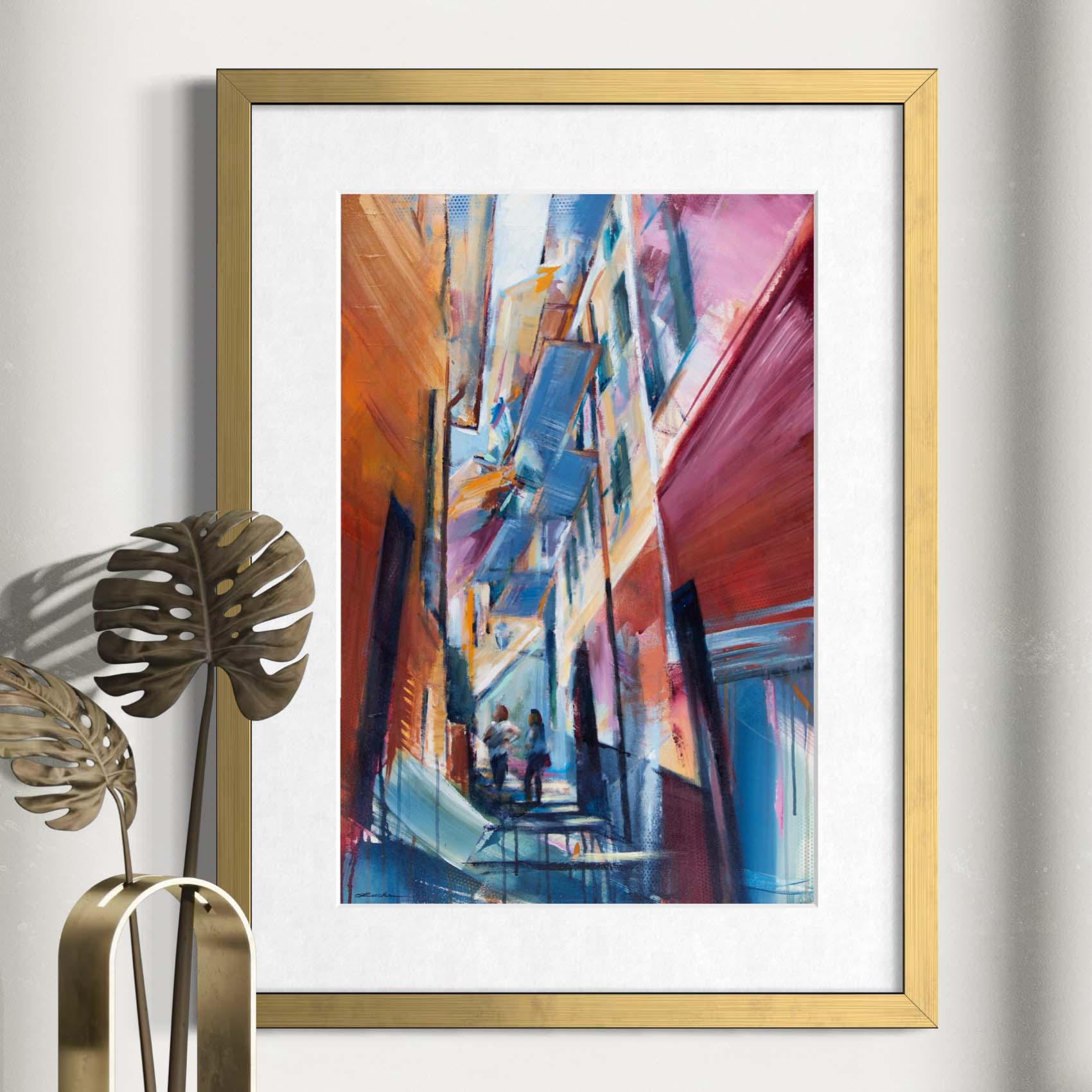 Women climbing Florence staircase by Kyle Lucks as a framed giclée fine art print in a gold frame, front view