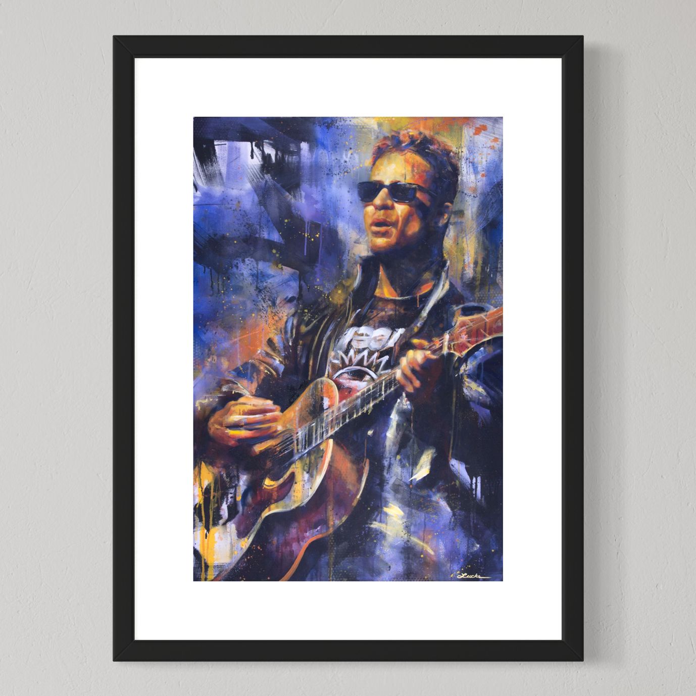 Musician Amos Lee performing live by Kyle Lucks as a framed giclée fine art print in a black frame, front view