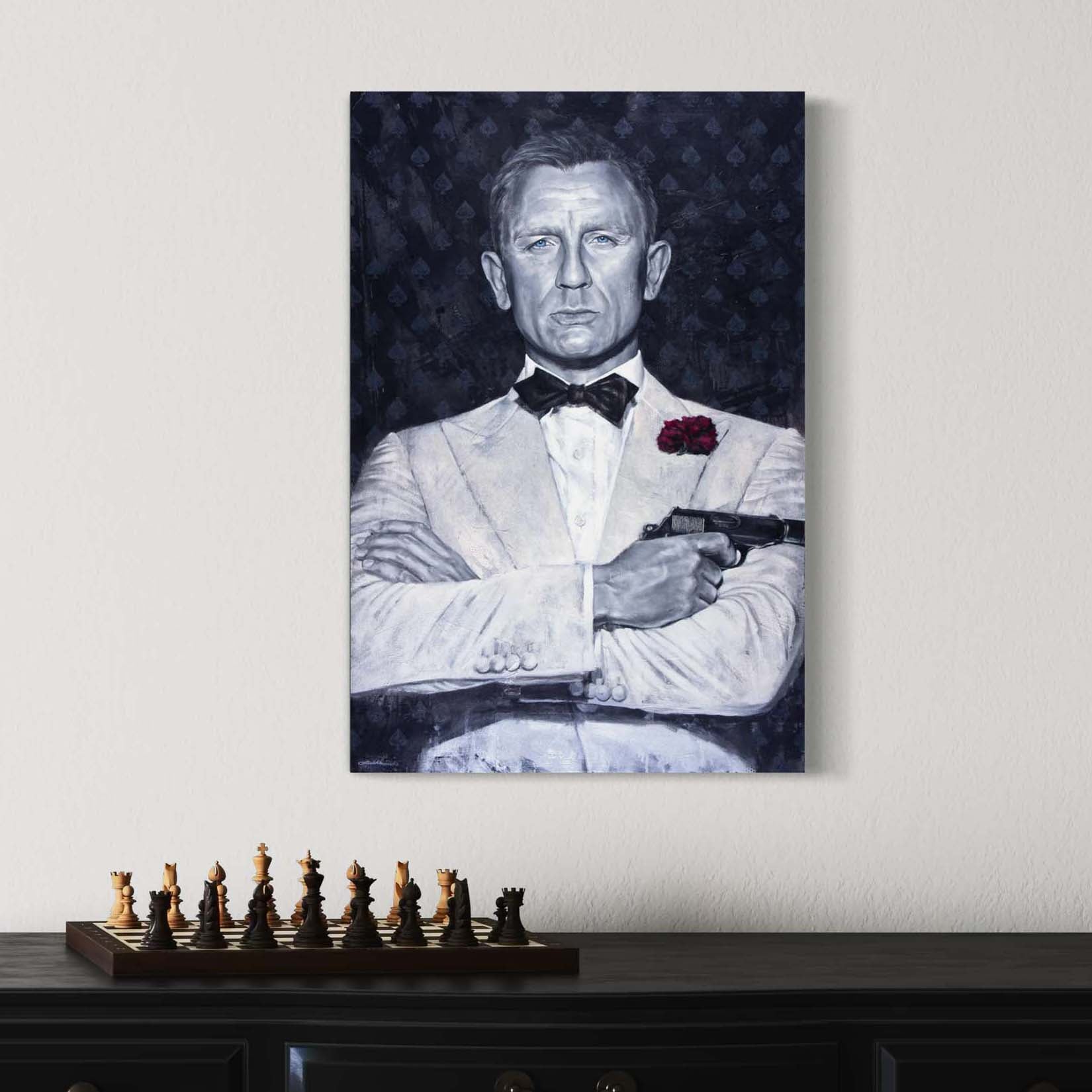 Portrait painting of Daniel Craig as secret agenct James Bond, wearing a white tuxedo, with his arms crossed and holding a gun. Dark gray background with spades symbol and the words Agent 007.