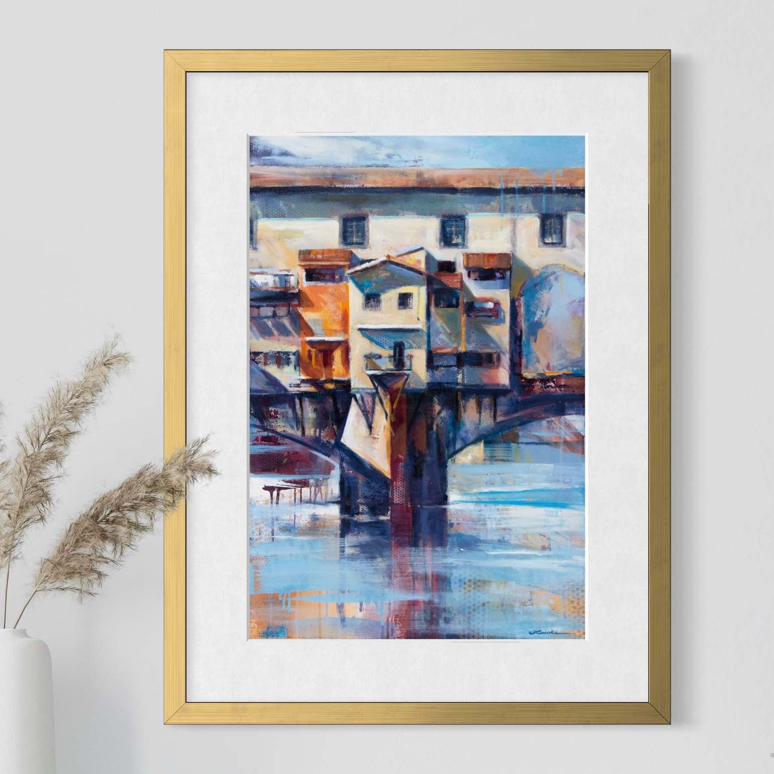 Florence's Ponte Vecchio bridge by Kyle Lucks as a framed giclée fine art print in a gold frame, front view