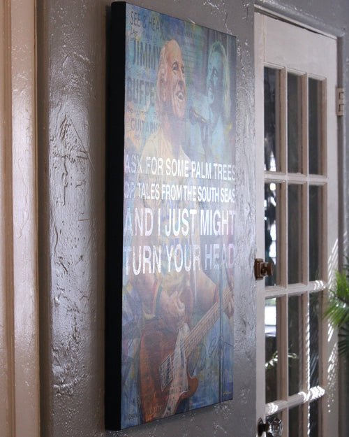 Close-up of hand-lettered lyrics with spot-varnish sheen from "Jimmy Buffett, the Storyteller" by Kyle Lucks