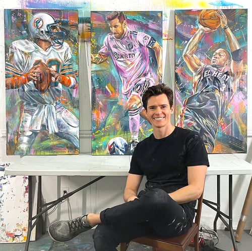 Kyle Lucks in his studio before the Miami Legends triptych, Wade canvas at right