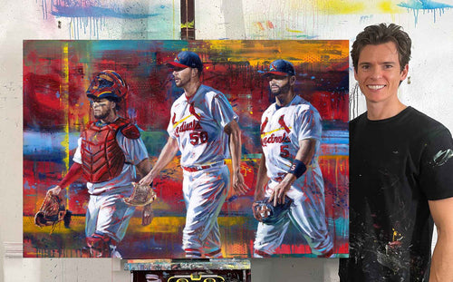 Kyle Lucks beside his 'Yadi, Waino and Albert' St. Louis Cardinals portrait in the studio