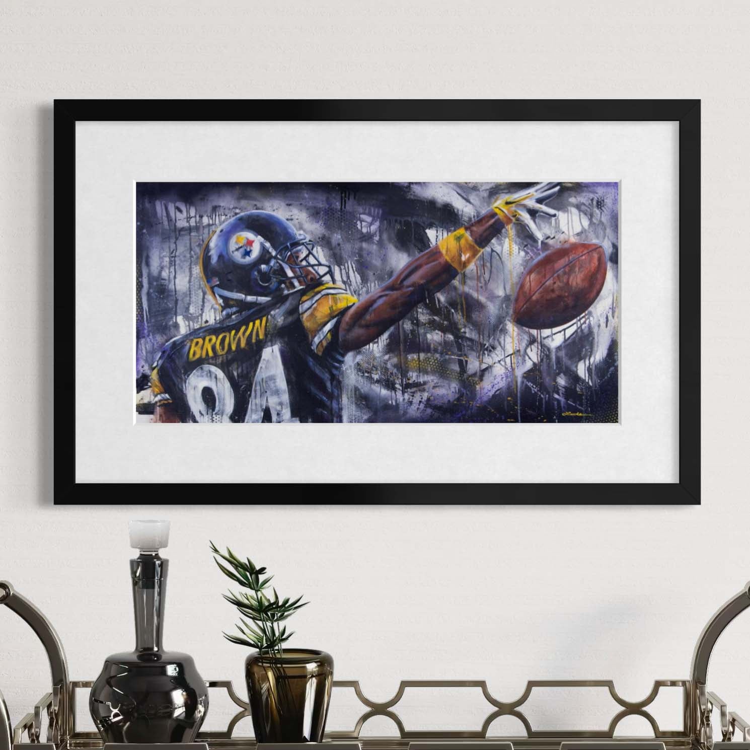Steelers wide receiver Antonio Brown reaching for the ball by Kyle Lucks as a framed giclée fine art print in a black frame, front view