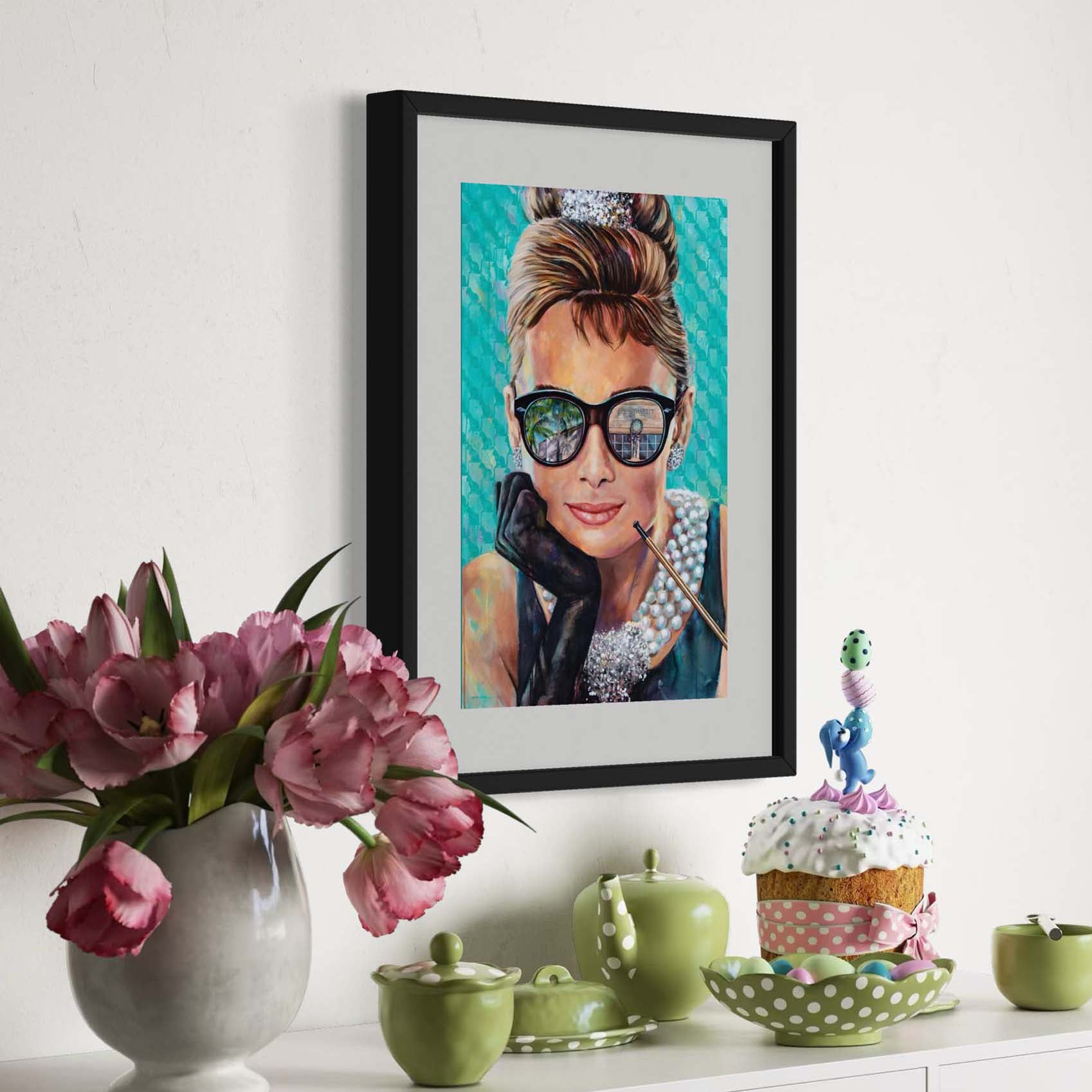 Painted portrait of Audrey Hepburn wearing a pearl necklace and oversized sunglasses with the reflection of the Tiffany & Co. store on Worth Avenue in Palm Beach, Florida. 