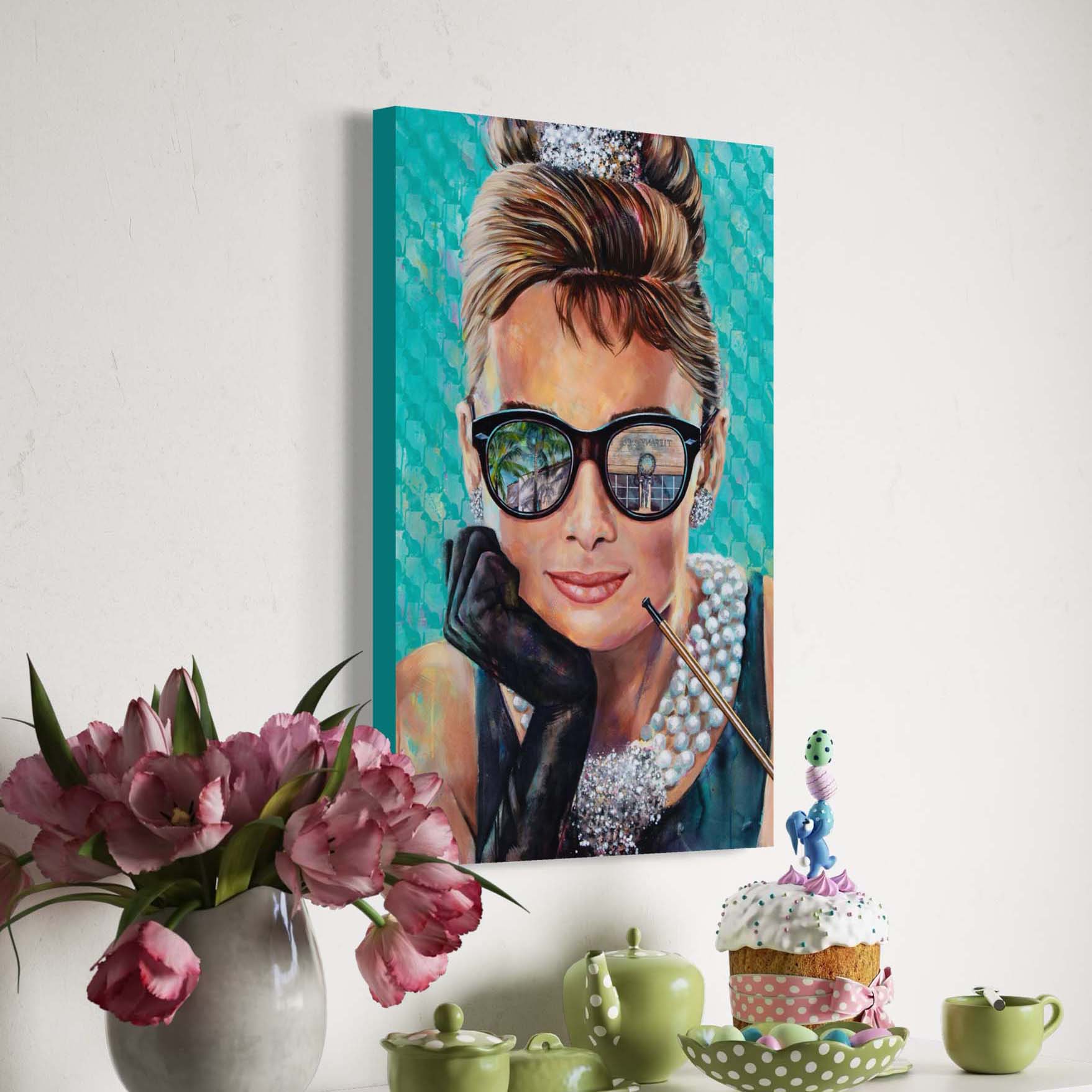 Painted portrait of Audrey Hepburn wearing a pearl necklace and oversized sunglasses with the reflection of the Tiffany & Co. store on Worth Avenue in Palm Beach, Florida. 