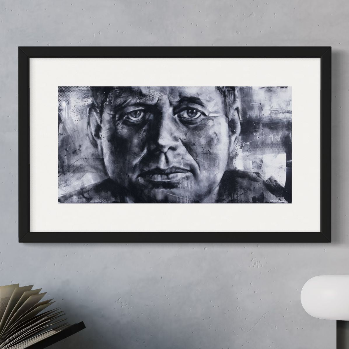Assassinated President John F. Kennedy by Kyle Lucks as a framed giclée fine art print in a black frame, front view