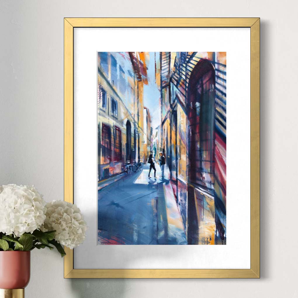 Stylish woman on Florence street by Kyle Lucks as a framed giclée fine art print in a gold frame, front view
